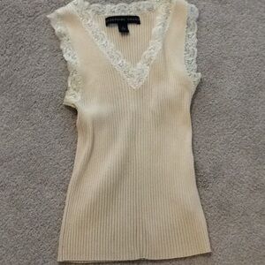 Cream colored sleeveless top by Josephine Chaus